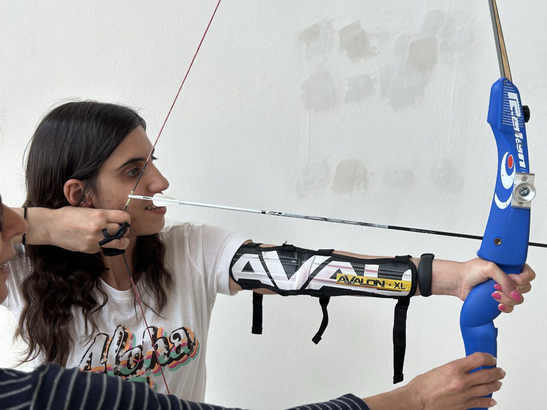 Sessione di tiro con l'arco con gli ipovedenti